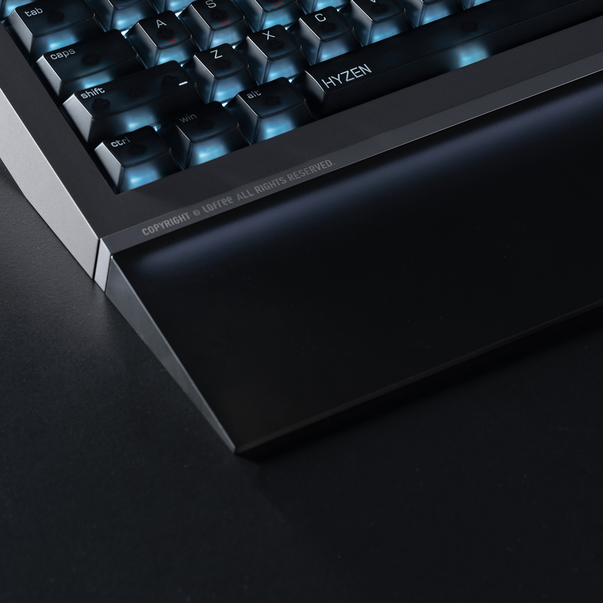 Lofree Hyzen67 Prism wrist rest in Space Gray in front of a Hyzen67 keyboard, close-up