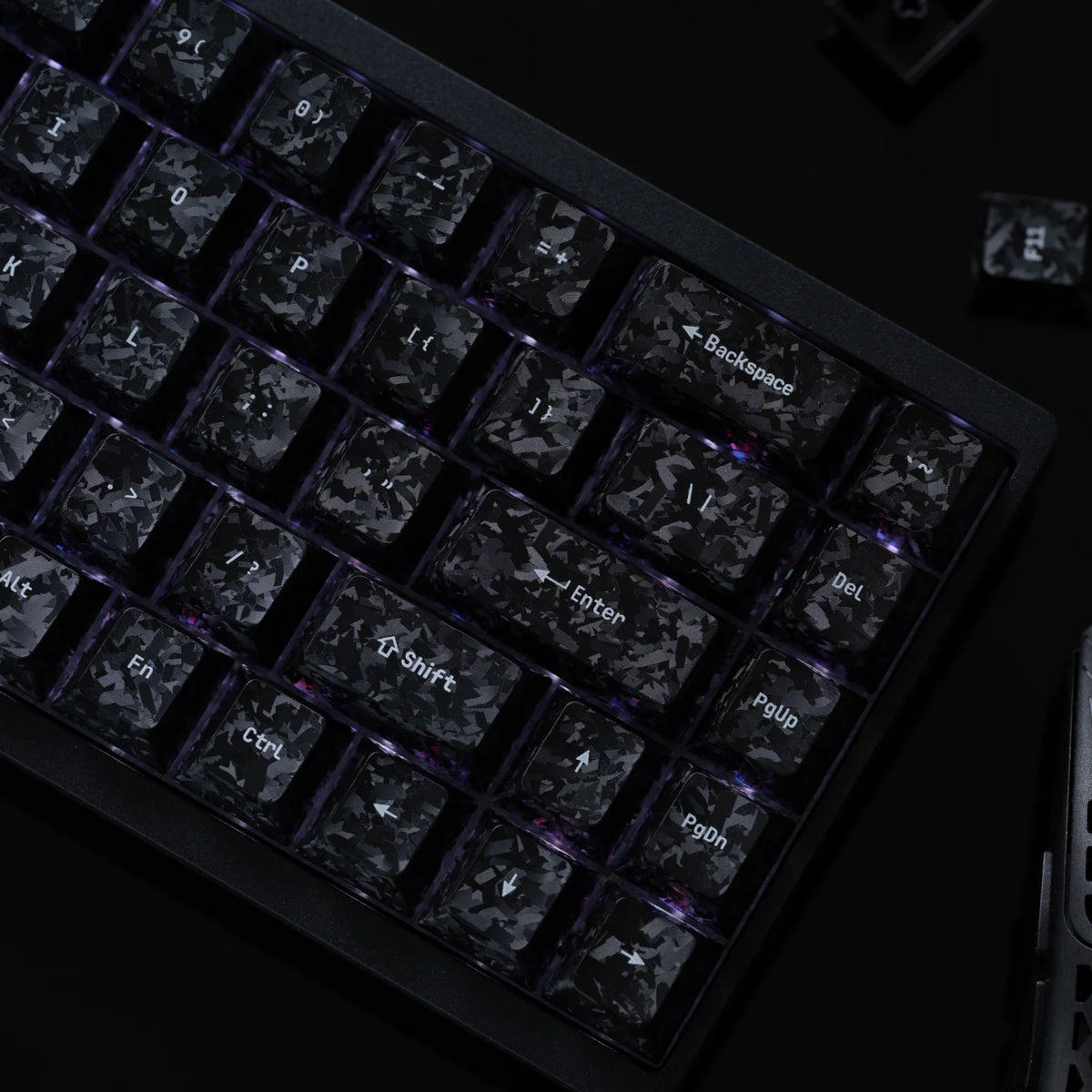 Carbon fibre textured keycaps on a backlit keyboard