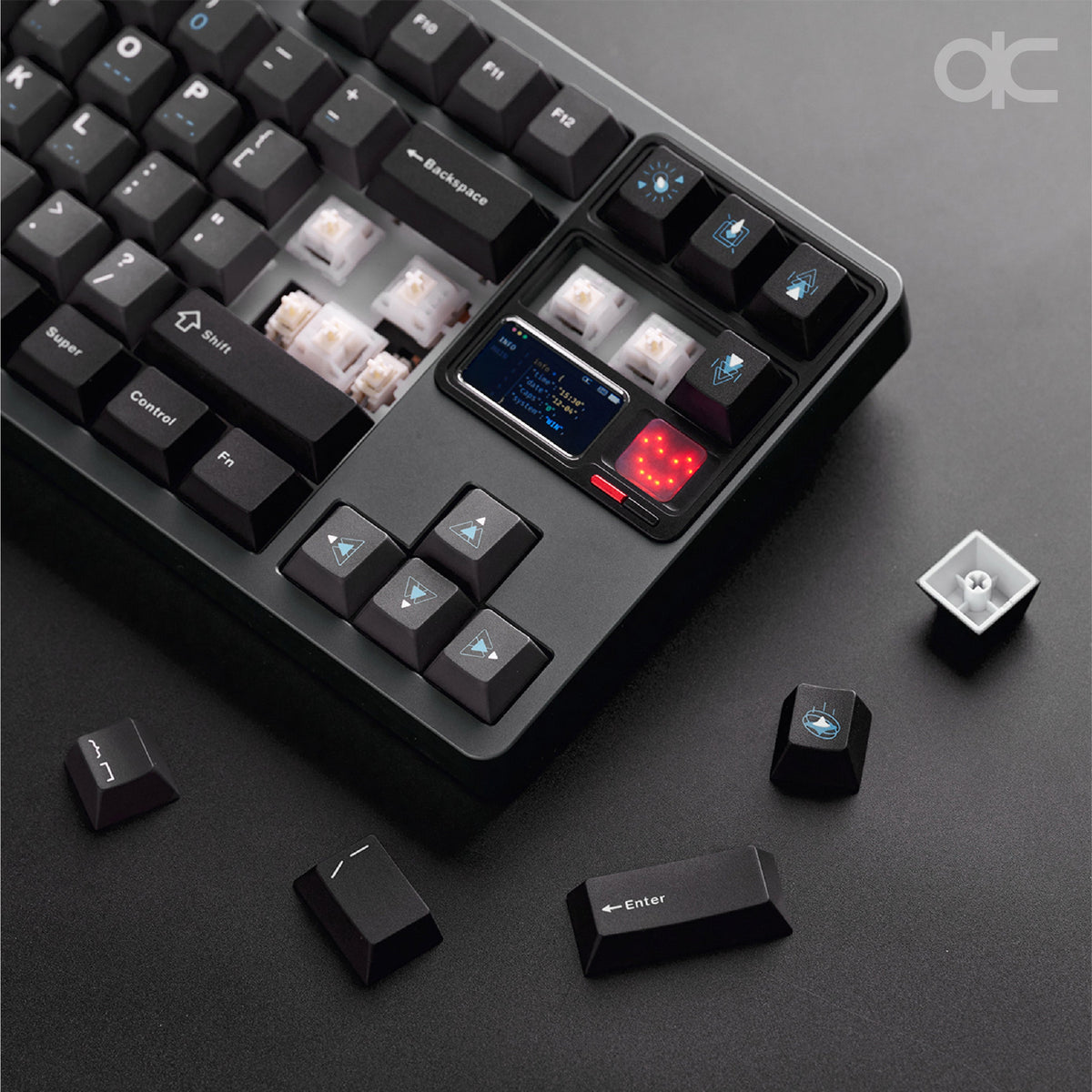 Close-up of the QK80 Mk2 in Anodized Grey with its screen and dark keycaps