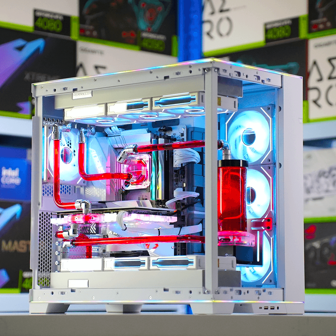 A custom water-cooled desktop computer with RGB lighting, displayed in a store setting.